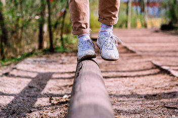 Feet on balance beam